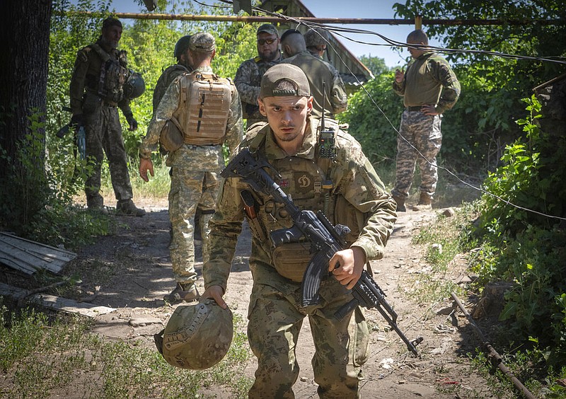 Ukrainian soldiers attend their positions, in the Donetsk region, Ukraine, Saturday, July 2, 2022. (AP Photo/Efrem Lukatsky)