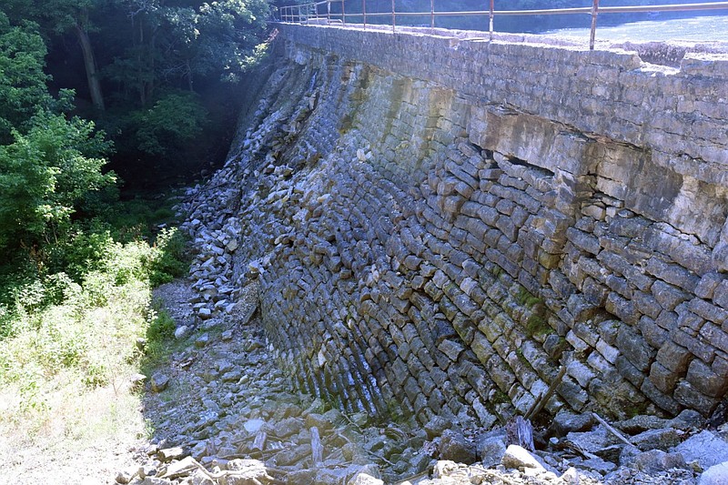 A stone dam backs up Black Bass Lake in Eureka Springs on Friday, July 1, 2022. (NWA Democrat-Gazette/Flip Putthoff)