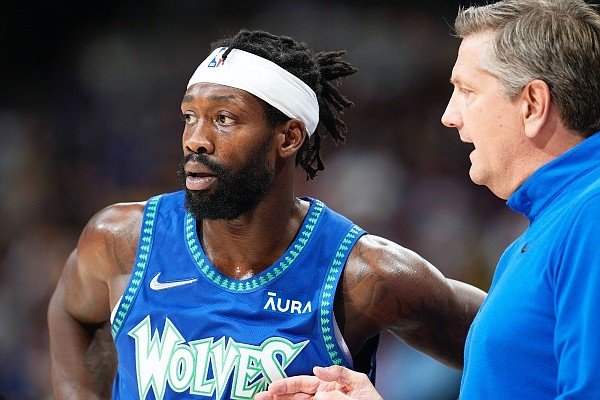 Timberwolves guard Patrick Beverley confers with head coach Chris Finch during a game earlier this month in Denver. (Associated Press)