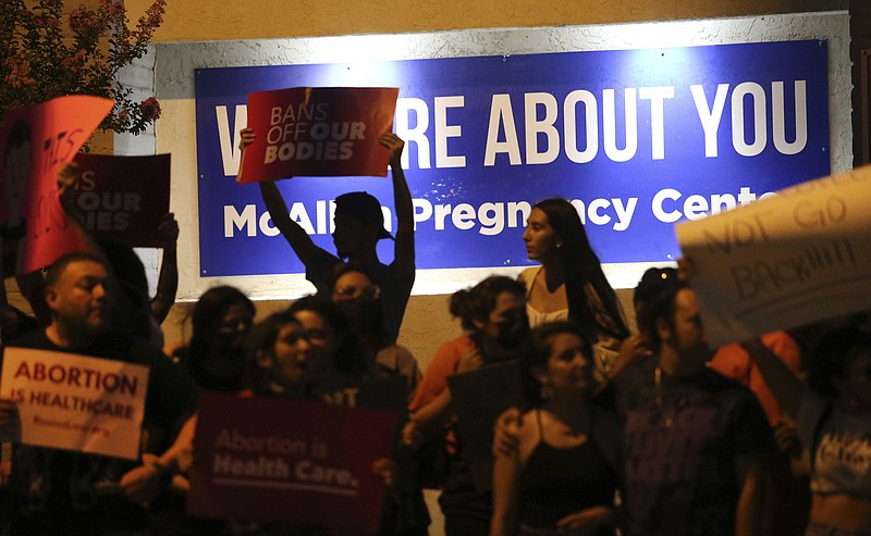Demonstrators gather outside the Whole Women's Health clinic Friday, June 24,2022 in McAllen, Texas. The one clinic that provides abortion services in the Rio Grande Valley ceased providing abortions on Friday following the Supreme Court ruling overturning abortion. (Delcia Lopez/The Monitor via AP)