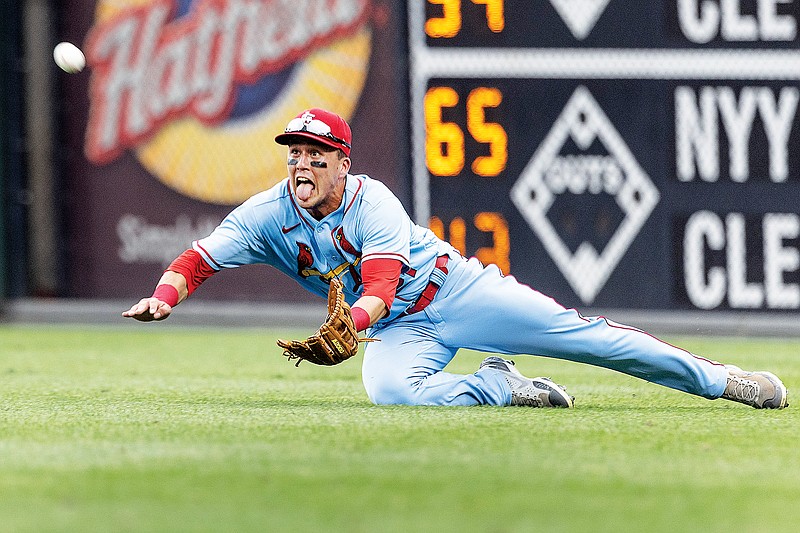 Cardinals right fielder Lars Nootbaar dives for a single by Alec Bohm of the Phillies during the third inning of Saturday afternoon’s game in Philadelphia. (Associated Press)