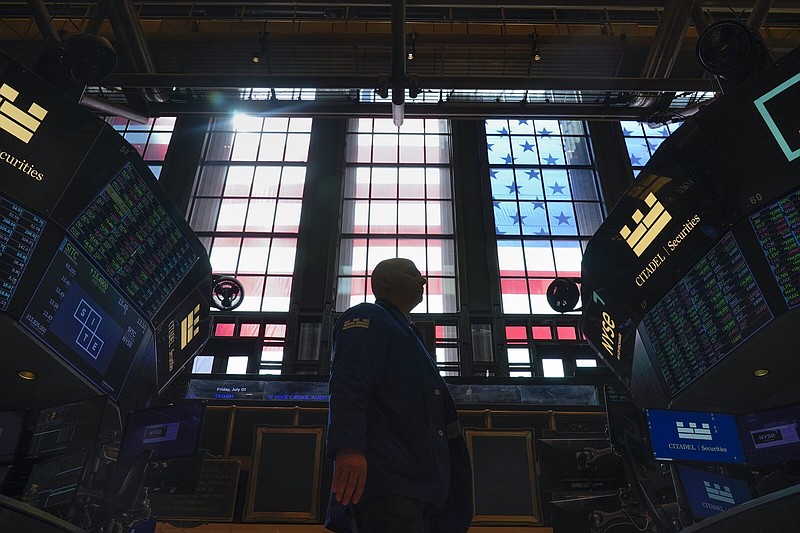 Traders work on the floor at the New York Stock Exchange on Friday. Stock indexes posted modest gains Wednesday after investors combed the minutes from the Federal Reserve’s most recent interest rate policy meeting.
(AP/Seth Wenig)