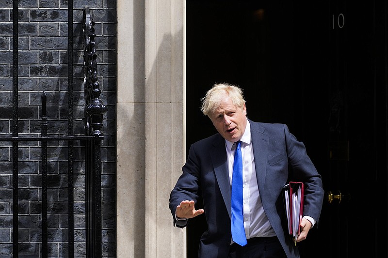 British Prime Minister Boris Johnson leaves 10 Downing Street Wednesday in London.
(AP/Frank Augstein)