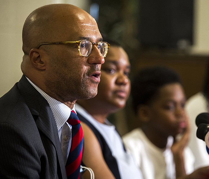 Attorney Mike Laux sits alongside the family of Tyrone Washington during a news conference Thursday. Washington was shot and killed by UAMS police on Dec. 3, 2020. The family has filed a federal lawsuit. More photos at arkansasonline.com/78lawsuit/
(Arkansas Democrat-Gazette/Stephen Swofford)