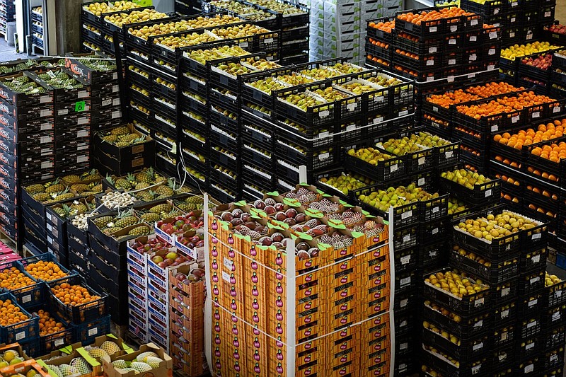 Boxes and crates of fresh fruit are stacked at the Mercado Abastecedor do Porto distributors in Porto, Portugal, in May. A United Nations measure of world food prices fell 2.3% in June.
(Bloomberg News WPNS/Eduardo Leal)