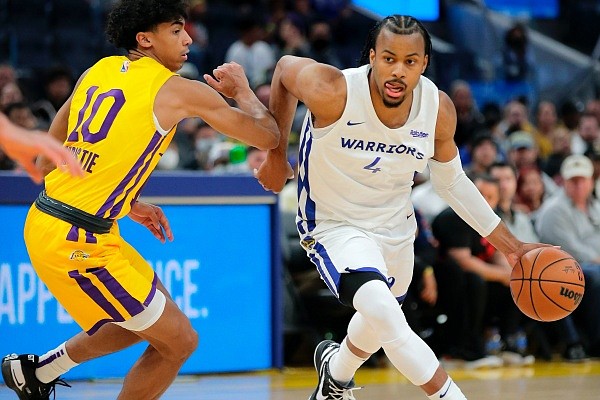 Moses Moody drives up court in the first half as the Golden State Warriors played the Los Angeles Lakers summer league teams in the California Classic at Chase Center in San Francisco, Calif., on Sunday, July 3, 2022. (Carlos Avila Gonzalez/San Francisco Chronicle via AP)