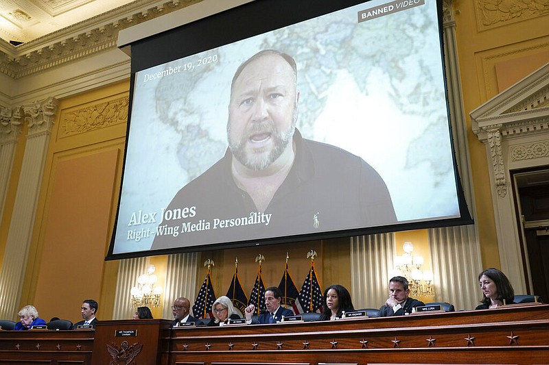 A video showing Alex Jones is shown as the House select committee investigating the Jan. 6 attack on the U.S. Capitol holds a hearing at the Capitol in Washington, Tuesday, July 12, 2022. (AP Photo/J. Scott Applewhite)
