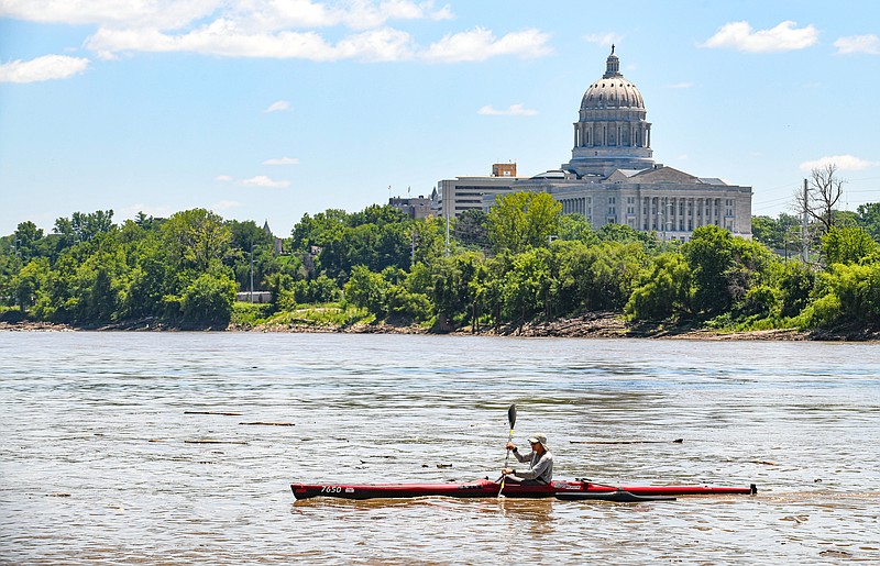 Jed Friedrichsen maneuvers his kayak through the wavy water to pull into Noren Access Wednesday, July 13, 2022, during the MR340 river race. (Julie Smith/News Tribune photo)