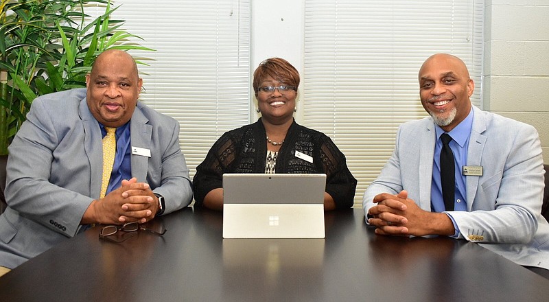 Kelvin Gragg (left) and Phillip Carlock (right) have joined the Pine Bluff School District as assistant superintendents to Barbara Warren, center. 
(Pine Bluff Commercial/I.C. Murrell)