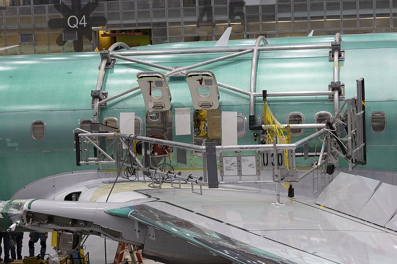 Boeing employees work on the 737 Max on the final assembly line at Boeing’s Renton plant on June 15 in Renton, Wash.
(AP/The Seattle Times/Ellen M. Banner)