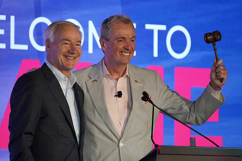 Arkansas Gov. Asa Hutchinson (left) and New Jersey Gov. Phil Murphy acknowledge applause at the National Governors Association summer meeting Friday in Portland, Maine.
(AP/Robert F. Bukaty)