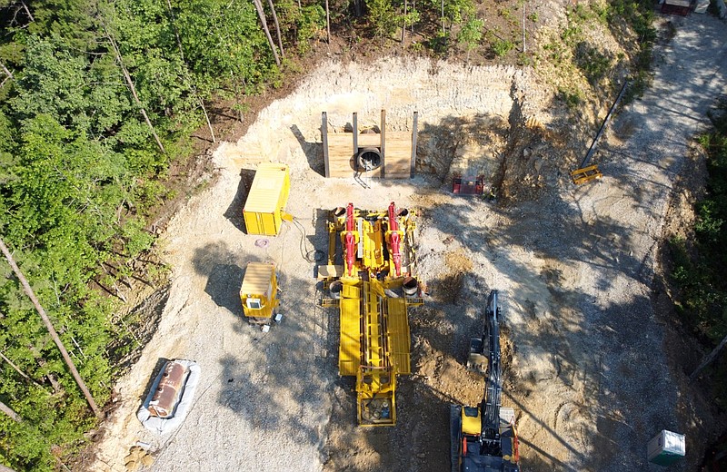 The southern slope of Blakely Mountain in Hot Springs is shown in this 2022 drone photo taken by the city of Hot Springs. The pipe thruster at the site, which will push the German-built micro-tunnel boring machine through Blakely Mountain, sits at the head of a 72-inch diameter encasement. (Courtesy photo)