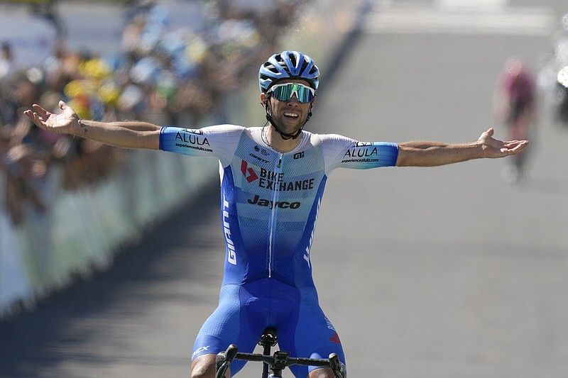 Stage winner Australia's Michael Matthews celebrates as he crosses the finish line of the fourteenth stage of the Tour de France cycling race over 192.5 kilometers (119.6 miles) with start in Saint-Etienne and finish in Mende, France, Saturday, July 16, 2022. 
(AP Photo/Thibault Camus)