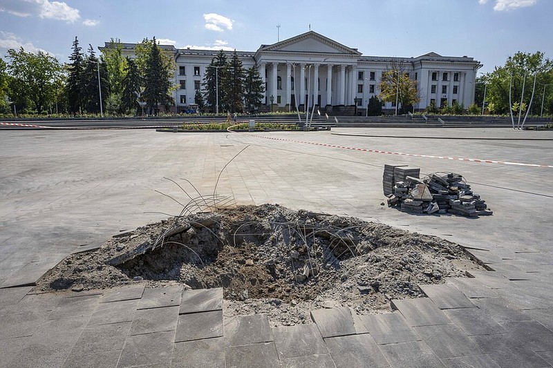 A crater in the aftermath of a Russian missile strike, in front of the city council hall building, in Kramatorsk city hall, eastern Ukraine, Saturday, July 16, 2022. (AP/Nariman El-Mofty)