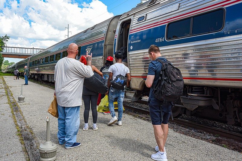 Passengers board the westbound Missouri River Runner train Monday, July 18, 2022, at the Jefferson City depot. It was the first day of the re-instituted two-a-day Amtrak passenger service, whereby there will be a morning and evening eastbound and westbound train each day. (Julie Smith/News Tribune photo)