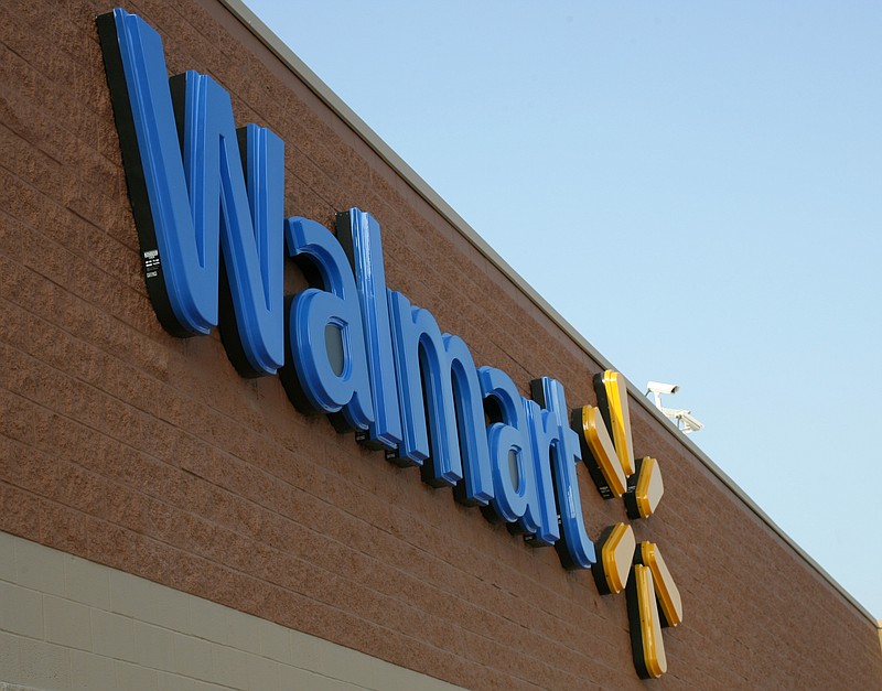 The Walmart sign at the company's historic Store No. 1 on Walnut Street in Rogers is shown in this August 2008 file photo. (Arkansas Democrat-Gazette file photo)