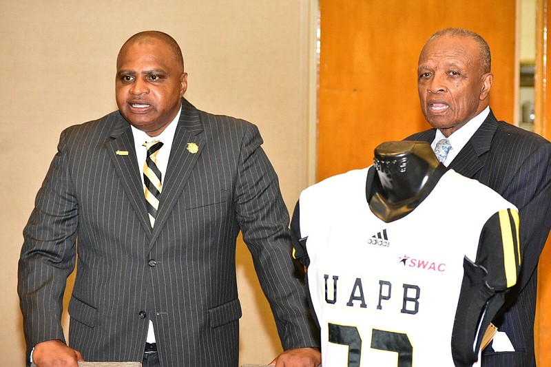 UAPB football Coach Doc Gamble and longtime college football broadcaster Charlie Neal chat during SWAC Media Day on Thursday. 
(Pine Bluff Commercial/I.C. Murrell)