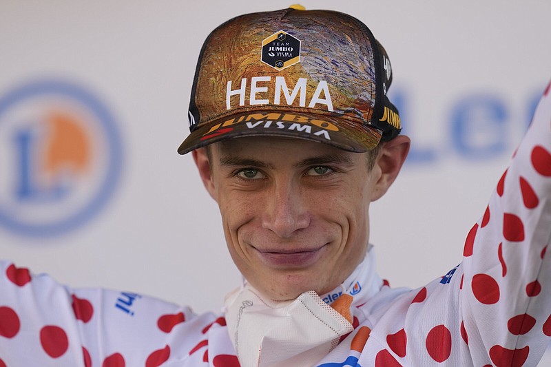 Stage winner and overall leader Denmark's Jonas Vingegaard also won the best climber's dotted jersey, during the eighteenth stage of the Tour de France cycling race over 143.5 kilometers (89.2 miles) with start in Lourdes and finish in Hautacam, France, Thursday, July 21, 2022. (AP Photo/Thibault Camus)