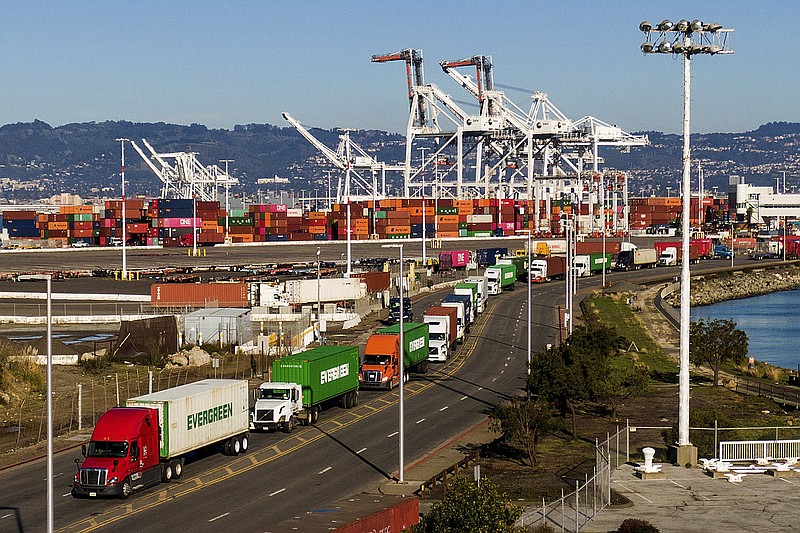 Trucks line up to enter a Port of Oakland shipping terminal in Oakland, Calif., in this file photo. Truckers protesting a state labor law have effectively shut down cargo operations at the Port of Oakland.
(AP)