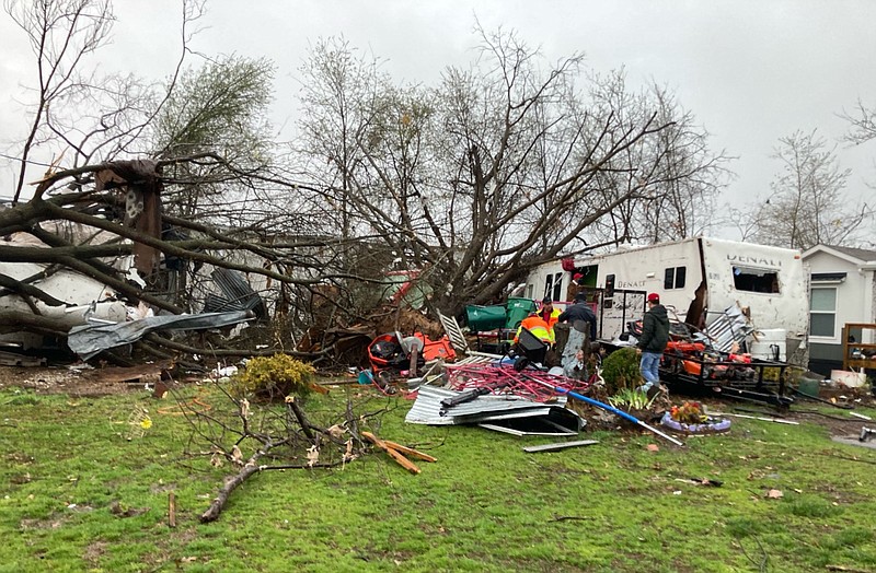 Damage from a tornado at Woodridge Estates Mobile Home Park on Powell Street in Springdale is shown in this March 20, 2022 file photo. (NWA Democrat-Gazette/Laurinda Joenks)