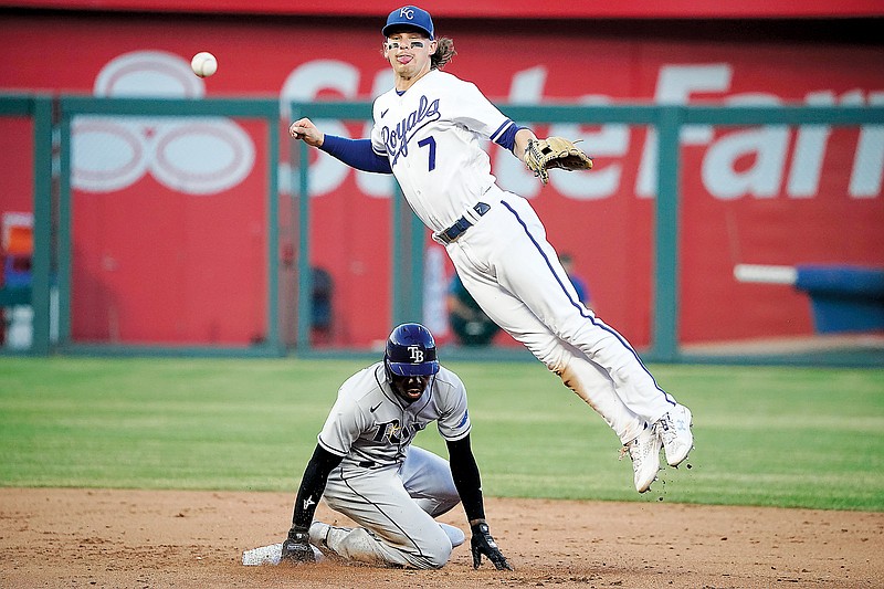 Kansas City Royals shortstop Bobby Witt Jr. throws to first base