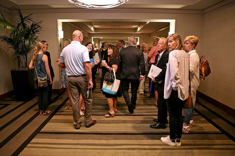 A group of people wait to gain entry into the Arkansas GOP convention at the Embassy Suites hotel in Little Rock on Saturday.
(Arkansas Democrat-Gazette/Colin Murphey)