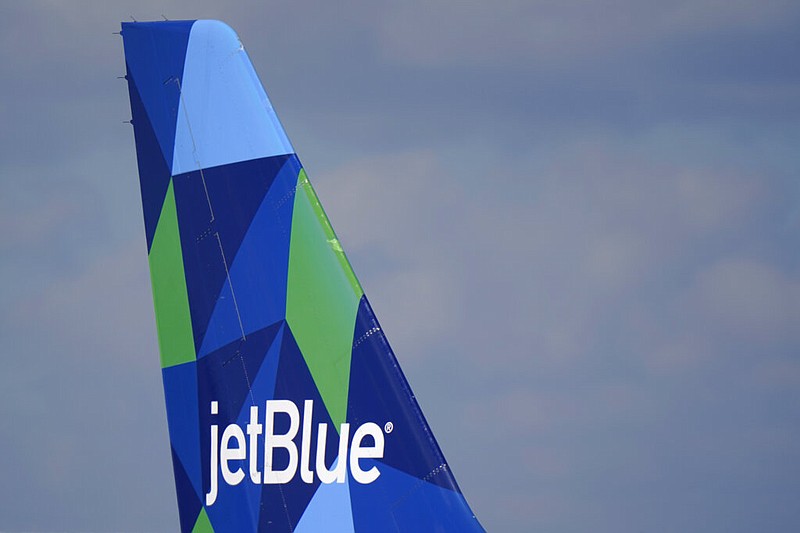 FILE - The tail of a JetBlue Airways Airbus A321 is shown as the plane prepares to take off from Fort Lauderdale-Hollywood International Airport, Tuesday, Jan. 19, 2021, in Fort Lauderdale, Fla. (AP/Wilfredo Lee, File)