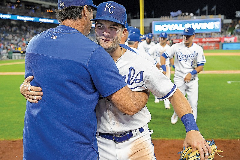 Royals manager Mike Matheny congratulates Andrew Benintendi after Monday night’s 7-0 win against the Angels at Kauffman Stadium in Kansas City. (Associated Press)