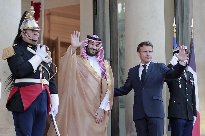 French President Emmanuel Macron (right) welcomes Saudi Crown Prince Mohammed bin Salman for a dinner at the Elysee Palace Thursday in Paris.
(AP/Lewis Joly)