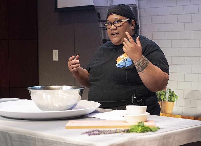 Chef Judy Tatios leads a demonstration on making coleslaw at the University of Arkansas, Fayetteville in this June 17, 2021 file photo. Tatios, who specializes in Marshallese cuisine, was addressing school superintendents and heads of child nutrition at an event hosted by the Northwest Arkansas Council. (NWA Democrat-Gazette/J.T. Wampler)