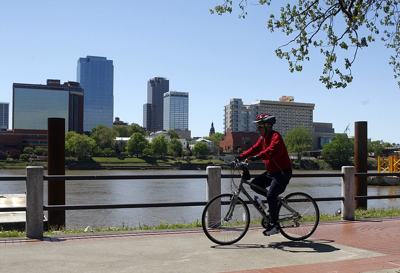 A cyclist makes his way down the bike trail in Riverfront Park in North Little Rock in this April 4, 2017 file photo. Planners envision the $55 million Central Arkansas Regional Greenways project as a way to encourage cycling as a primary 
choice of transportation. (Arkansas Democrat-Gazette file photo)