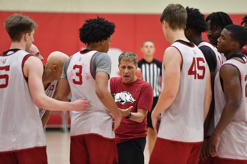 Arkansas men’s basketball Coach Eric Musselman gives players directions during a practice last week. Junior transfer Ricky Council has shown athleticism during early practices, but Musselman said he wants him to improve upon that. “Defensively, we want him to continue to improve and evolve,” Musselman said.
(NWA Democrat-Gazette/Andy Shupe)