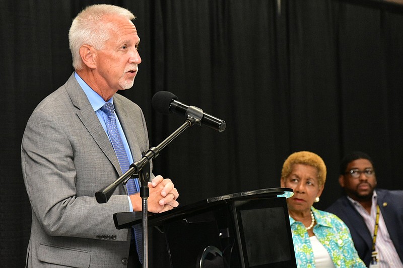 John A. Tuell, executive director of the Robert F. Kennedy National Resource Center for Juvenile Justice, introduces the program as Pine Bluff Mayor Shirley Washington and Jefferson County Sheriff Lafayette Woods Jr. look on Tuesday at the Pine Bluff Convention Center. 
(Pine Bluff Commercial/I.C. Murrell)