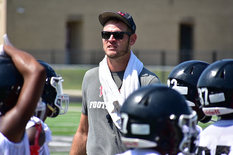 First-year White Hall High School Coach Ryan Mallett coaches defensive backs during practice Tuesday at Bulldog Stadium. 
(Pine Bluff Commercial/I.C. Murrell)