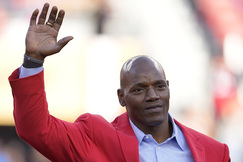 Former San Francisco 49ers player Bryant Young waves during a ceremony for his induction into the team's Hall of Fame during halftime of an NFL football game between the 49ers and the Arizona Cardinals in Santa Clara, Calif., Sunday, Nov. 7, 2021. 
(AP Photo/Tony Avelar)