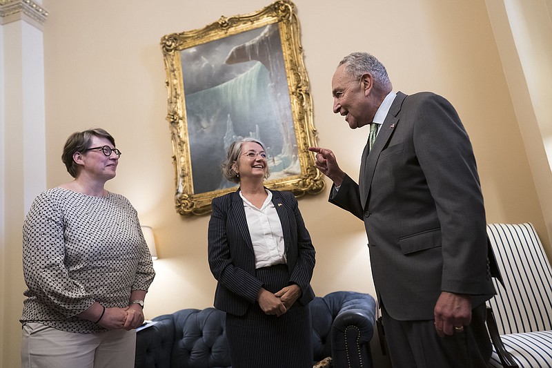 Senate Majority Leader Charles Schumer on Wednesday welcomes Paivi Nevala (left), minister counselor of the Finnish Embassy, and Karin Olofsdotter, Sweden’s ambassador to the United States, just before the Senate vote to ratify NATO membership for the two nations. Schumer had invited the diplomats to the Senate chamber to watch the vote.
(AP/J. Scott Applewhite)