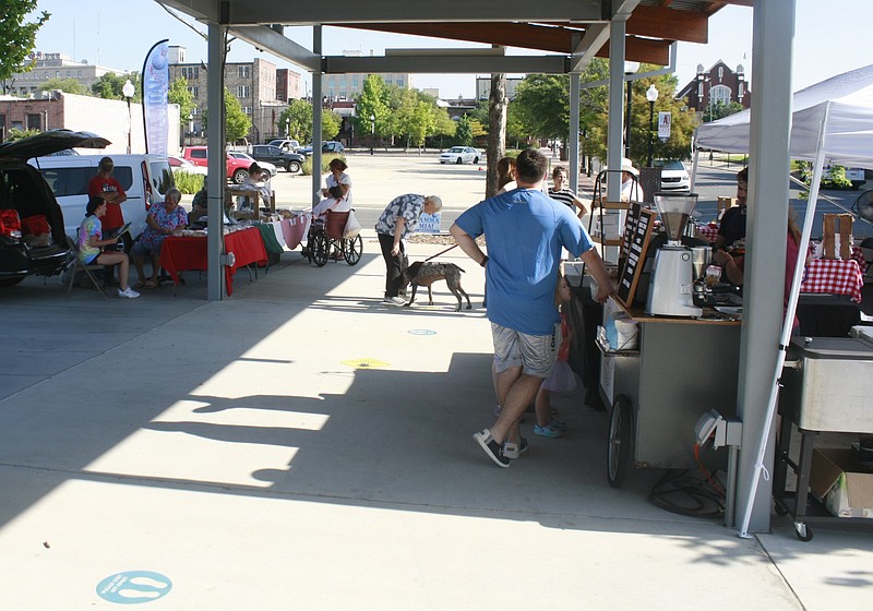 The MAD Farmers Market in El Dorado is shown in this July 23, 2022 file photo. The market near the Amphitheatre is held each Saturday. (Special to the Arkansas Democrat-Gazette/Matt Hutcheson)