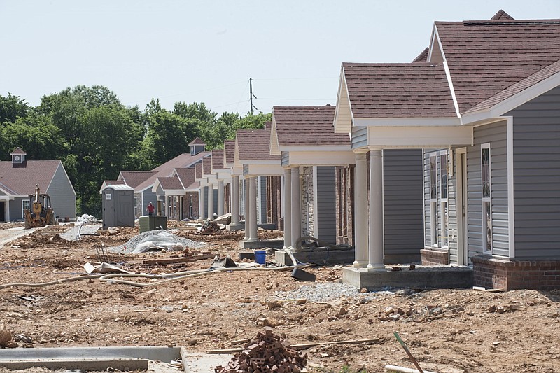 FILE — Rows of houses are seen under construction in the Mansions, a multifamily development off Mill Street in Springdale, in this May 2018 file photo. (NWA Democrat-Gazette/Spencer Tirey)