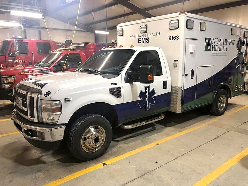 A Northwest Health EMS ambulance is housed in the Highfill Fire Department in this undated courtesy photo.