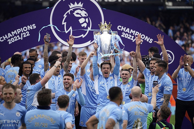 Manchester City players celebrate after winning the Premier League title last season. This weekend, NBC will begin its 10th season of covering the Premier League and Peter Drury has been tabbed as the lead play-by-play announcer.
(AP/Dave Thompson)