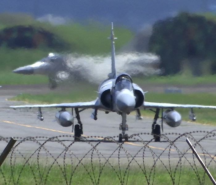 Taiwan Air Force Mirage fighter jets taxi on a runway Friday at an airbase in Hsinchu, Taiwan; meanwhile, Chinese aircraft and ships reportedly crossed the median line in the Taiwan Strait between the island and the mainland.
(AP/Johnson Lai)