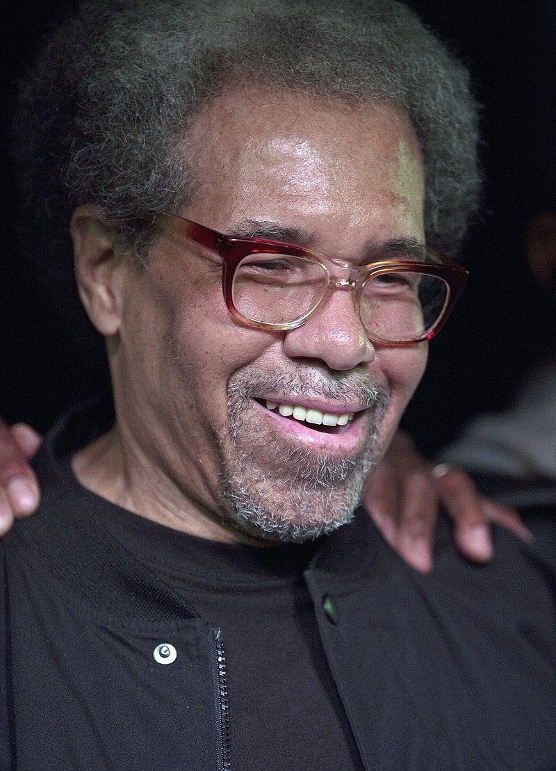 Albert Woodfox smiles as he arrives on stage during his first public appearance at the Ashe Cultural Arts Center in New Orleans, Friday, Feb. 19, 2016, after his release from Louisiana State Penitentiary in Angola, La., earlier in the day. Woodfox, who was the last of three high-profile Louisiana prisoners known as the "Angola Three" to be released, died Thursday, Aug. 4, 2022, of complications from COVID-19, according to a statement from his family. He was 75.
 (AP Photo/Max Becherer, File)