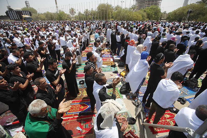 Followers of Shiite cleric Muqtada al-Sadr attend open-air Friday prayers at Grand Festivities Square within the Green Zone, in Baghdad, Iraq.
(AP/Anmar Khalil)