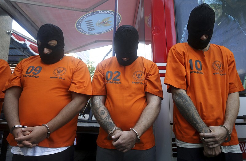 Foreign suspects detained on drug charges are displayed during a news conference on Friday in Bali, Indonesia.
(AP/Firdia Lisnawati)