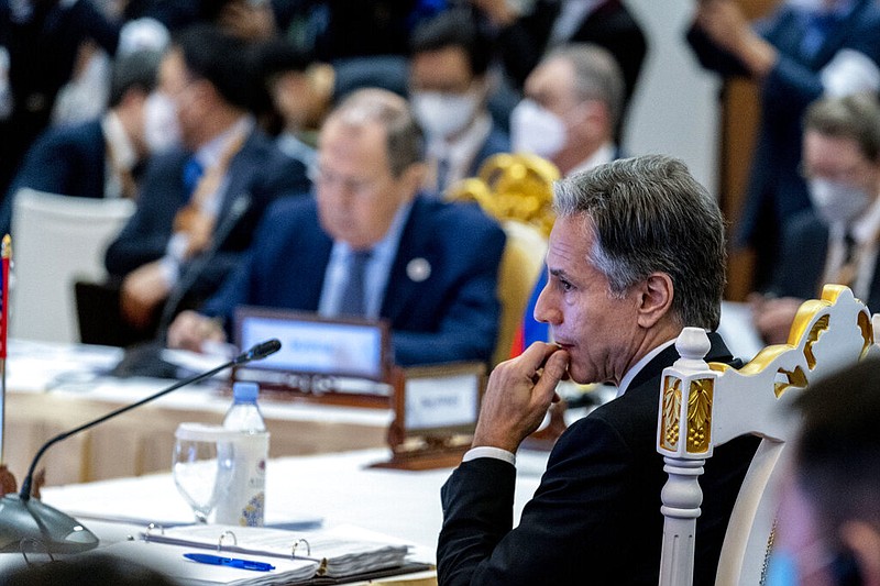 Secretary of State Antony Blinken, right, and Russian Foreign Minister Sergey Lavrov, left, are seated close together during an east Asia summit foreign ministers meeting at Sokha Hotel in Phnom Penh, Cambodia, Friday, Aug. 5, 2022. (AP/Andrew Harnik, Pool)