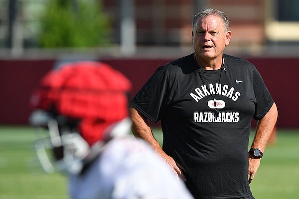 Arkansas coach Sam Pittman speaks to his players Friday, Aug. 5, 2022, during practice at the university practice facility in Fayetteville.
