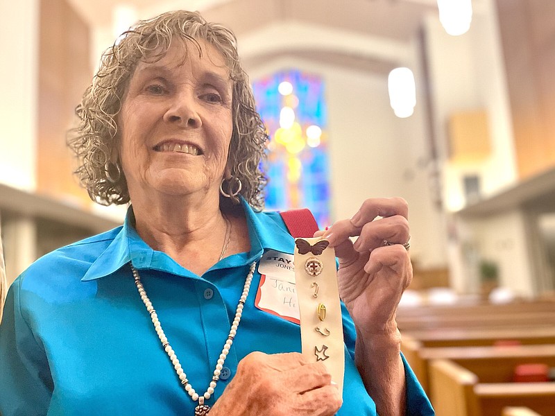 As Methodist ministers, Janis Anderson Hill’s grandparents and father dedicated their lives to spreading the gospel. Before voting against disaffiliation at Jonesboro First United Methodist Church Sunday, she rounded up some of their old faith-based lapel pins, plus a Sunday School badge she had earned many decades ago. More photos at arkansasonline.com/86methodist/
(Arkansas Democrat-Gazette/Frank E. Lockwood)