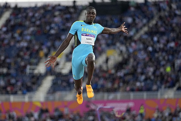 Laquan Nairn of The Bahamas makes an attempt in the Men's long jump final during the athletics competition in the Alexander Stadium at the Commonwealth Games in Birmingham, England, Thursday, Aug. 4, 2022. (AP Photo/Alastair Grant) Laquan Nairn of The Bahamas makes an attempt in the Men's long jump final during the athletics competition in the Alexander Stadium at the Commonwealth Games in Birmingham, England, Thursday, Aug. 4, 2022. (AP Photo/Alastair Grant)