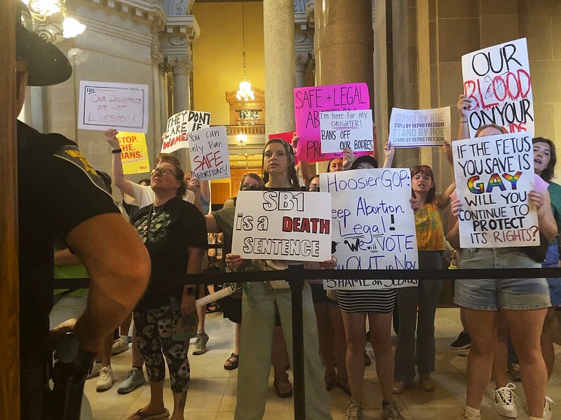 Abortion-rights protesters fill Indiana Statehouse corridors and cheer outside legislative chambers, Friday, Aug. 5, 2022, as lawmakers vote to concur on a near-total abortion ban, in Indianapolis. (AP/Arleigh Rodgers)
