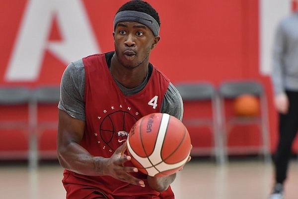 Arkansas guard Davonte Davis drives to the lane Wednesday, July 27, 2022, during practice in the Eddie Sutton Men's Basketball Practice Gym on the university campus in Fayetteville.